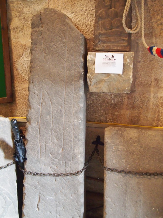 Carved blades on a medieval tombstone