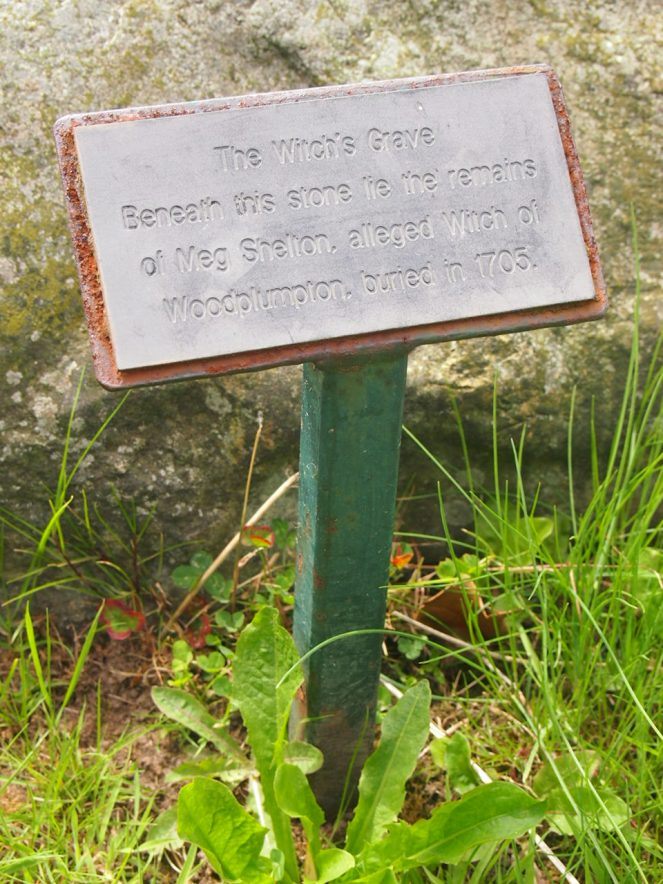 A little plaque explains that the boulder covers Meg's grave